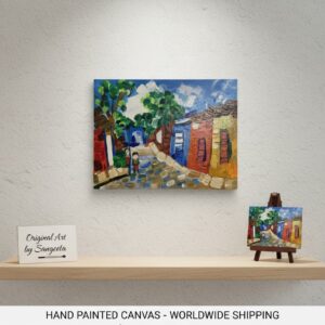 Original colorful street scene painting by Sangeeta, featuring textured houses and trees on a cobblestone street.