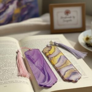 Handmade acrylic bookmarks set by Sangeeta styled on an open book